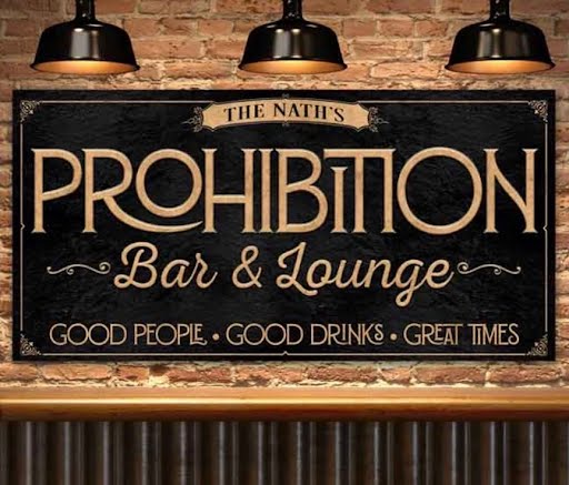 Prohibition-style bar and lounge sign with warm lamp lighting